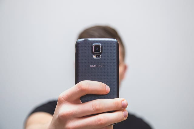 person taking selfie