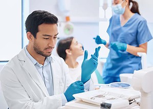 Dental patient with dental nurse and dentist 