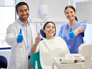 dentist and dental nurse with patient